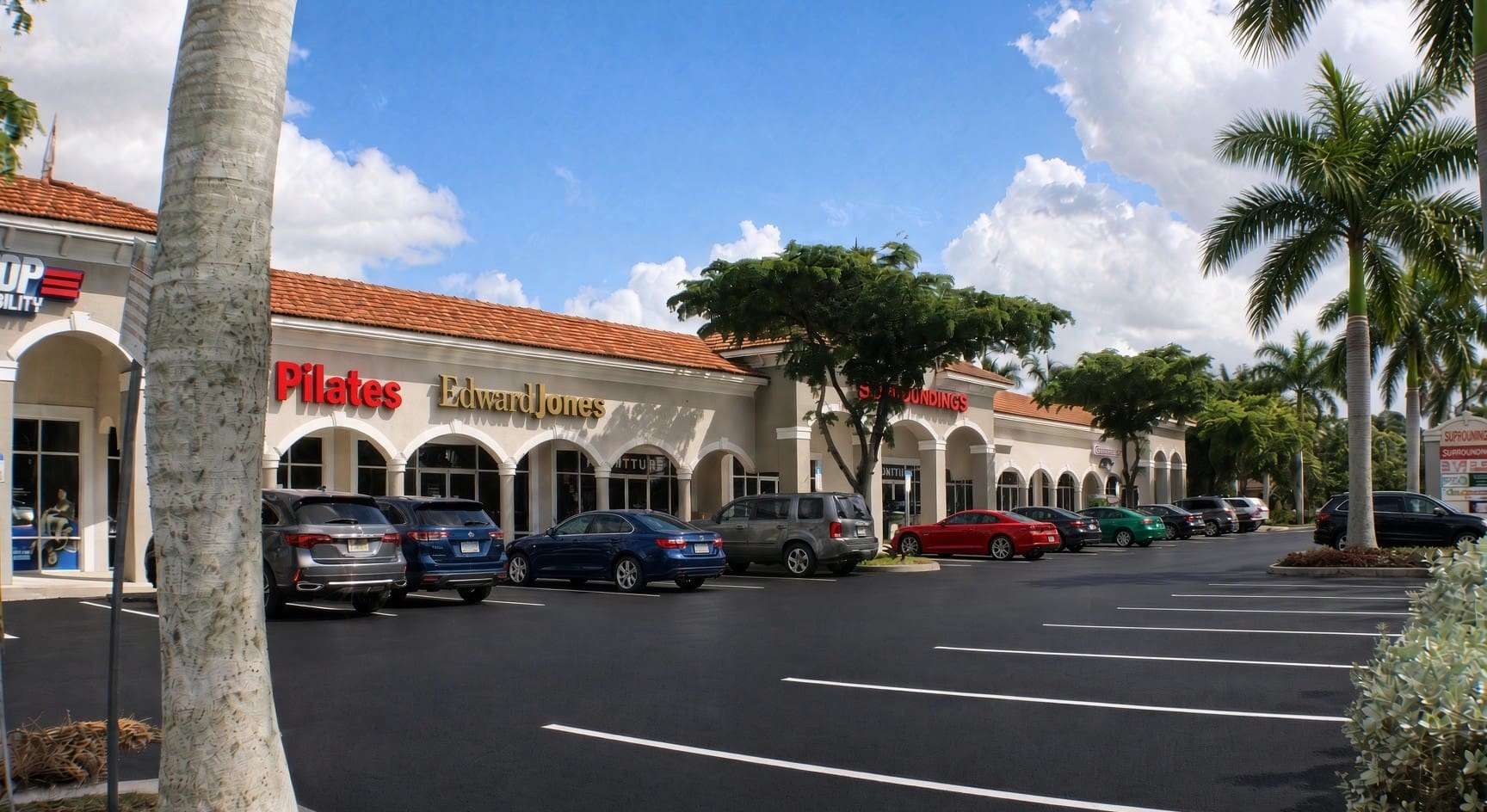 Arched storefronts with Pilates and Edward Jones at Surroundings, 12980 Tamiami Trail N, Naples, FL