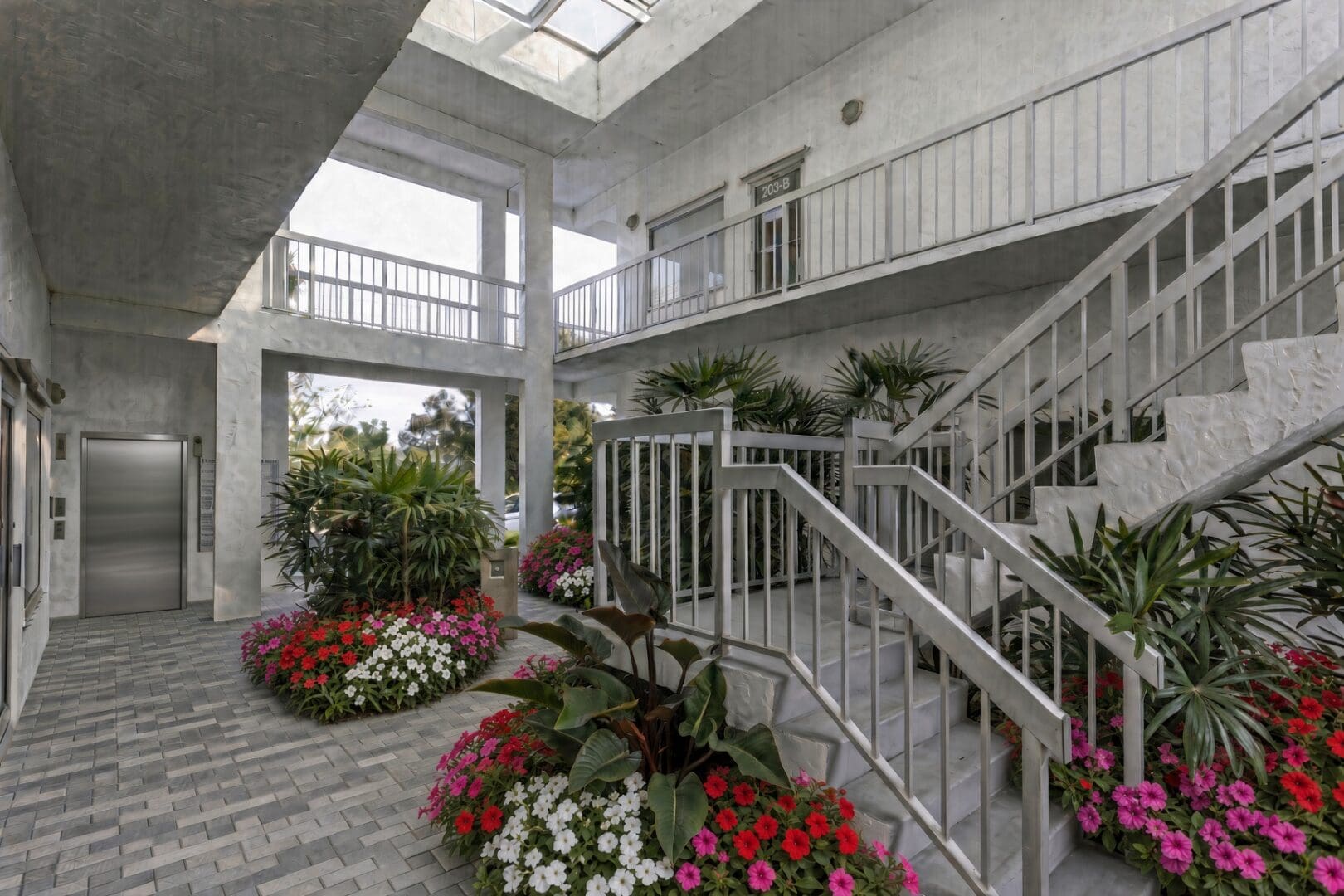 Atrium with gray pavers at North Trail Building, 1250 Tamiami Trail N, Naples, FL
