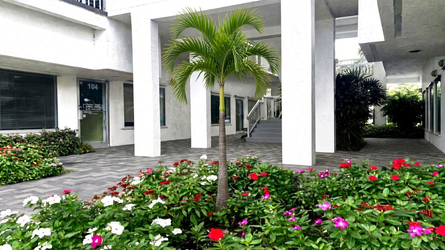 Courtyard with gray pavers at North Trail Building, 1250 Tamiami Trail N, Naples, FL