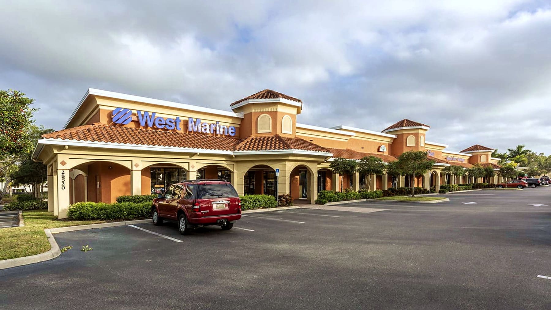 Tile-roof storefront arcade at Bonita Crossings, Bonita Springs, FL